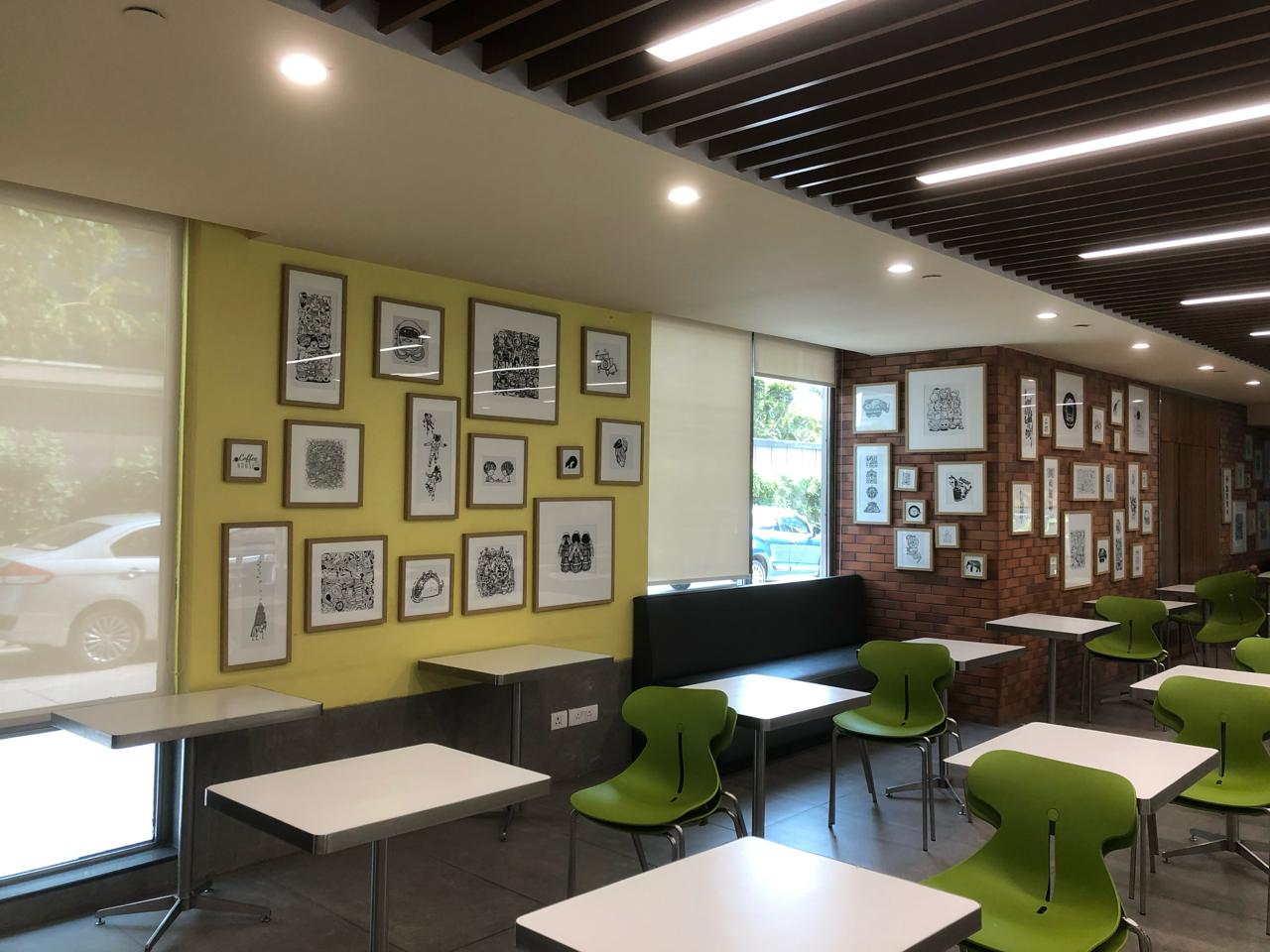 Modern Cafeteria with Yellow Art Wall